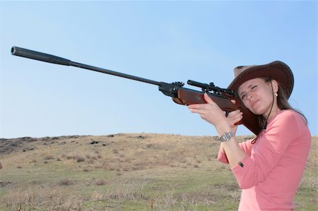 The young  woman with rifle is shooting Stock Photo - Budget Royalty-Free & Subscription, Code: 400-05069767