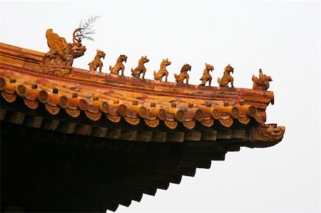 statues on building top - Imperial rooftop of a building inside the Forbidden City in Beijing with various statues of mystical animals and dragons. Stock Photo - Budget Royalty-Free & Subscription, Code: 400-05062299