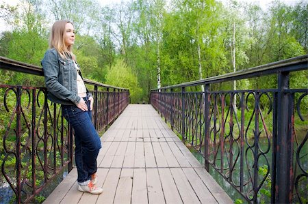 Young Woman Looking Forward From The Bridge Stock Photo - Budget Royalty-Free & Subscription, Code: 400-05062904