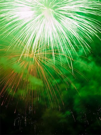 simsearch:400-04573554,k - Fireworks rockets exploding against dark sky. Stock Photo - Budget Royalty-Free & Subscription, Code: 400-05079773