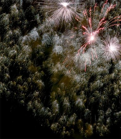 simsearch:400-04573554,k - Fireworks rockets exploding against dark sky. Stock Photo - Budget Royalty-Free & Subscription, Code: 400-05079800