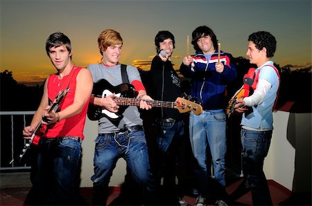simsearch:400-04026083,k - Portrait of trendy group of young musicians having fun with their instruments Stock Photo - Budget Royalty-Free & Subscription, Code: 400-05070681