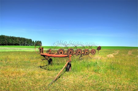 simsearch:400-03991406,k - old farm machine on a field, focus set on machine Stock Photo - Budget Royalty-Free & Subscription, Code: 400-05070929