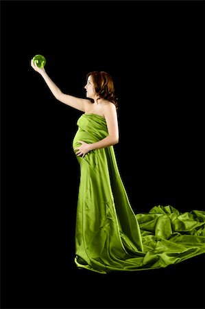 Beautiful Pregnant woman holding a Crystal Ball with a beautiful dress Stock Photo - Budget Royalty-Free & Subscription, Code: 400-05070973