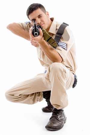 simsearch:400-04072400,k - soldier going to shoot with gun on an isolated background Stock Photo - Budget Royalty-Free & Subscription, Code: 400-05084991