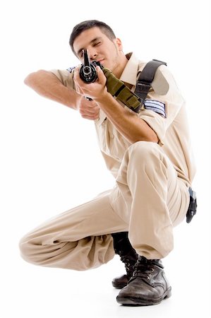 simsearch:400-04072400,k - sitting soldier going to shoot with gun on an isolated background Stock Photo - Budget Royalty-Free & Subscription, Code: 400-05084992