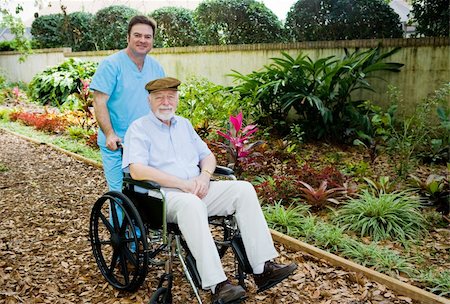 Nursing home orderly takes a senior man for a walk in the garden. Stock Photo - Budget Royalty-Free & Subscription, Code: 400-05087619