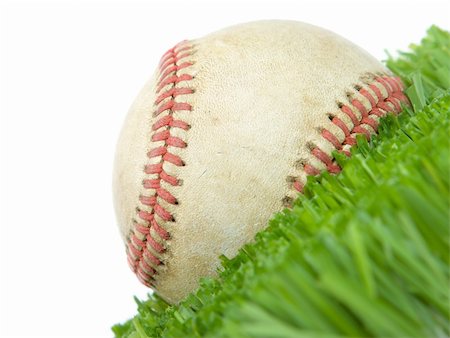 Softball in grass close up isolated on white Stock Photo - Budget Royalty-Free & Subscription, Code: 400-05088668