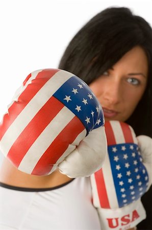 simsearch:400-04970057,k - cute brunette with usa boxing gloves giving a punch Stock Photo - Budget Royalty-Free & Subscription, Code: 400-05088769