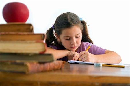 simsearch:400-08315791,k - girl pupel sitting by the table with globe and red apple on a pile of books, Isolated on white Foto de stock - Super Valor sin royalties y Suscripción, Código: 400-05080525