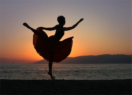 dramatic dancer jump photography - Dramatic image of a woman dancing by the ocean at sunset, silhouette Stock Photo - Budget Royalty-Free & Subscription, Code: 400-05082917