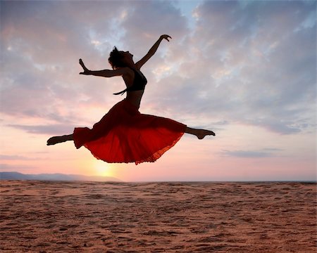 dramatic dancer jump photography - Dramatic image of a woman jumping above the ocean at sunset, silhouette Stock Photo - Budget Royalty-Free & Subscription, Code: 400-05083285