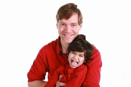 sticking out her tongue - Happy father and son in red shirts isolated on white Stock Photo - Budget Royalty-Free & Subscription, Code: 400-05083437