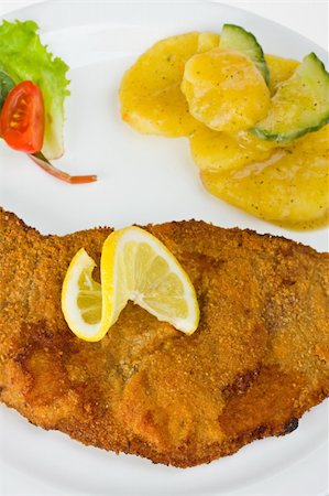 closeup of a  Viennese escalope (Wiener Schnitzel) Stock Photo - Budget Royalty-Free & Subscription, Code: 400-05094119