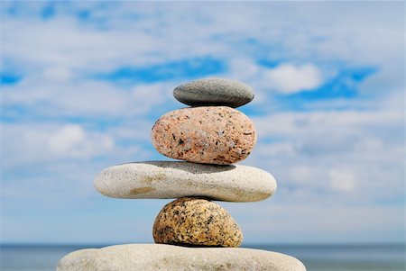 simsearch:400-05373814,k - Four different stones in a pile on a beach in the summer at midday Stock Photo - Budget Royalty-Free & Subscription, Code: 400-05094369