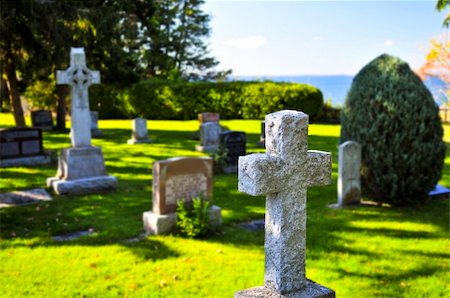simsearch:400-04032243,k - Bright graveyard lawn with ancient tombstone crosses Stock Photo - Budget Royalty-Free & Subscription, Code: 400-05094719