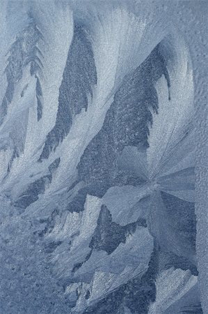 frosted texture - Pattern from ice crystals on glass. The frozen window in winter day. Stock Photo - Budget Royalty-Free & Subscription, Code: 400-05094807