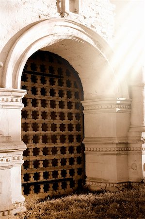 Old wooden sunny gates of a church in izmaylovo where Peter The Great from the ex-russian empire have lived. Slightly vintaged and sepia effect added Stock Photo - Budget Royalty-Free & Subscription, Code: 400-05095406