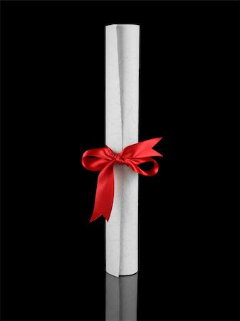 simsearch:400-04408371,k - Diploma with a red silk ribbon, isolated on black background. Stock Photo - Budget Royalty-Free & Subscription, Code: 400-05095502