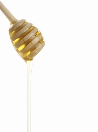 simsearch:400-05135233,k - Wooden honey drizzler with a  honey isolated on white. Foto de stock - Super Valor sin royalties y Suscripción, Código: 400-05097501