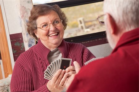 Happy Senior Adult Couple Playing Cards in Their RV. Stock Photo - Budget Royalty-Free & Subscription, Code: 400-05098107