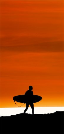 silhouette walking with surfboard - Surfer walking the cliffs to the ocean at Santa Cruz, California for a final sunset ride Stock Photo - Budget Royalty-Free & Subscription, Code: 400-05099515