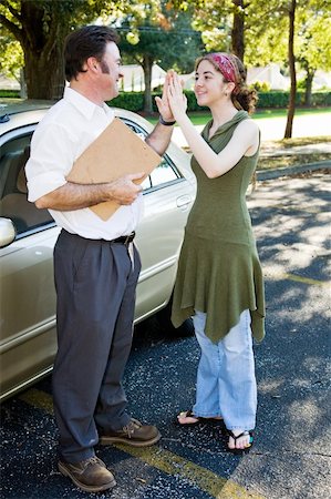family car dealer - Driving instructor giving a teen girl high five for passing her drivers test. Stock Photo - Budget Royalty-Free & Subscription, Code: 400-05093068