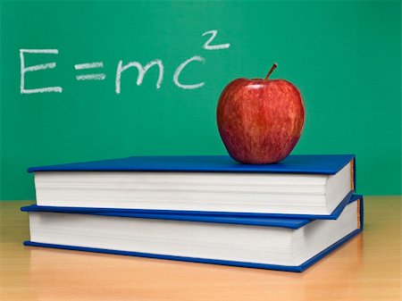 simsearch:400-04917346,k - Einsteins formula of theory of relativity on a chalkboard. An apple over books on foreground. Stock Photo - Budget Royalty-Free & Subscription, Code: 400-05104664