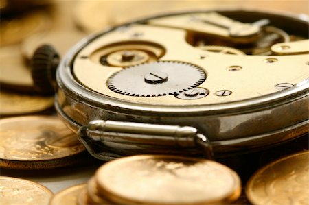 simsearch:700-05803434,k - time is money coins and clock macro concept Stock Photo - Budget Royalty-Free & Subscription, Code: 400-05100039