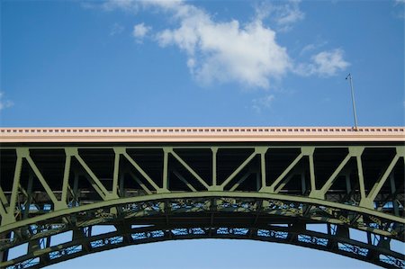 Carnegie Bridge over the Cuyahoga river Cleveland Ohio. Shot taken from the river just before sunset with clouds in the background. Stock Photo - Budget Royalty-Free & Subscription, Code: 400-05102306