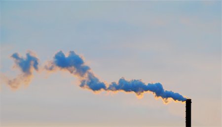 simsearch:400-07171274,k - The smoke from a pipe is illuminated by the sun at sunset Stock Photo - Budget Royalty-Free & Subscription, Code: 400-05115064