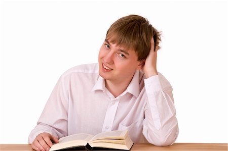 simsearch:400-04704759,k - Handsome man sitting and reading in library over white background Stock Photo - Budget Royalty-Free & Subscription, Code: 400-05115265