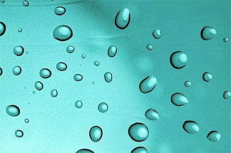 simsearch:400-05363406,k - Water droplets on a transparent blue surface Stock Photo - Budget Royalty-Free & Subscription, Code: 400-05116391