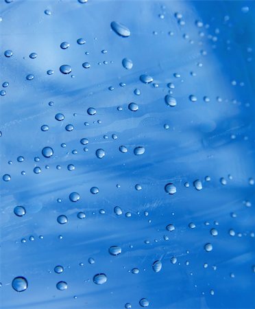 simsearch:400-05363406,k - Small water droplets on a transparent blue surface Stock Photo - Budget Royalty-Free & Subscription, Code: 400-05116427
