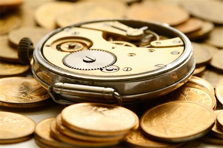 simsearch:700-05803434,k - time is money coins and clock macro concept Stock Photo - Budget Royalty-Free & Subscription, Code: 400-05117433