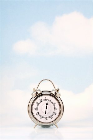 simsearch:400-04206274,k - Retro style timer against sky background with clouds Stock Photo - Budget Royalty-Free & Subscription, Code: 400-05117652
