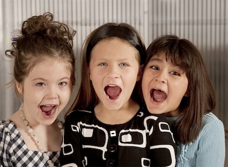 simsearch:400-04099373,k - Closeup of three cute young girls screaming Stock Photo - Budget Royalty-Free & Subscription, Code: 400-05117661