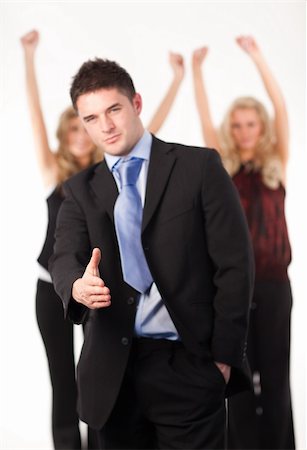 simsearch:400-04790442,k - Attractive businessman with thumb up and his successful team in the background Stock Photo - Budget Royalty-Free & Subscription, Code: 400-05118083