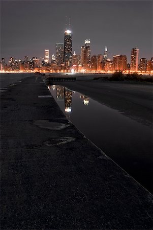 dark eerie sky - Chicago night skyline with partial beach and water reflections Stock Photo - Budget Royalty-Free & Subscription, Code: 400-05110538