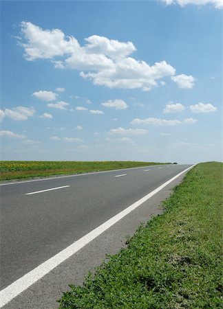 simsearch:400-05112302,k - Asphalt road. A transport highway with the blue sky. A transport highway with the blue sky Stock Photo - Budget Royalty-Free & Subscription, Code: 400-05112245