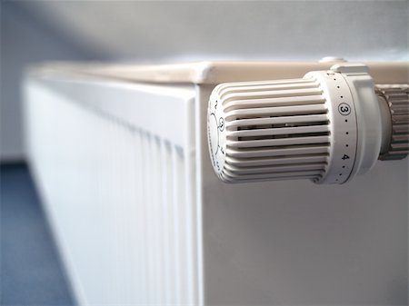 electric heater - The picture shows a white radiator with a thermostat Stock Photo - Budget Royalty-Free & Subscription, Code: 400-05113556
