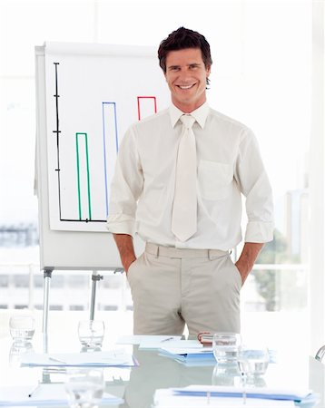 simsearch:400-05710386,k - Man standing before his team at a presentation Stock Photo - Budget Royalty-Free & Subscription, Code: 400-05128304