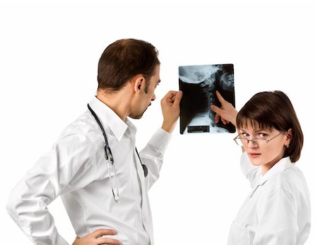 Two doctors watching an x-ray photo of a neck area Stock Photo - Budget Royalty-Free & Subscription, Code: 400-05129204