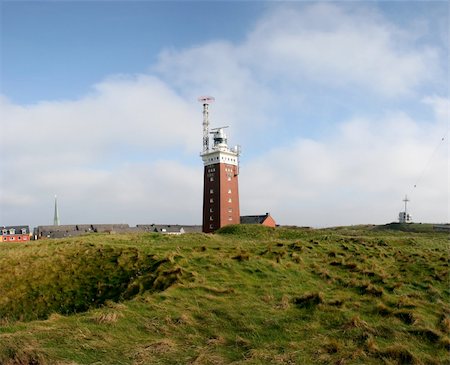 Lighthouse of Helgoland, island in the german north sea. In the foreground weathered bomb impacts. Stock Photo - Budget Royalty-Free & Subscription, Code: 400-05129402