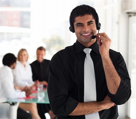simsearch:400-03933798,k - Young Businessman talking on a headset Stock Photo - Budget Royalty-Free & Subscription, Code: 400-05129754