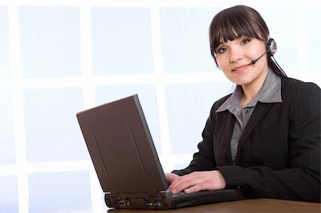 simsearch:400-05287143,k - attractive brunette woman in office Stock Photo - Budget Royalty-Free & Subscription, Code: 400-05122271