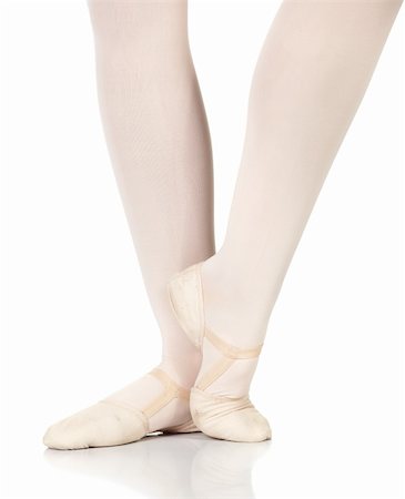 simsearch:400-04119672,k - Young caucasian ballerina girl on white background and reflective white floor showing various ballet steps and positions. Petit retire. Not Isolated. Stock Photo - Budget Royalty-Free & Subscription, Code: 400-05122343