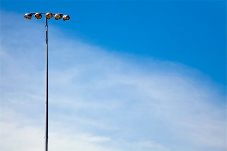 Lights for night games in an outdoor football stadium Stock Photo - Budget Royalty-Free & Subscription, Code: 400-05135034