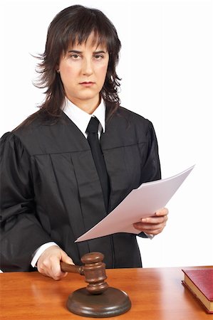 simsearch:700-00028739,k - A female judge in a courtroom reading the verdict and striking the gavel. Shallow depth of field Stock Photo - Budget Royalty-Free & Subscription, Code: 400-05135306
