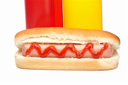 simsearch:400-04587885,k - A hot dog with ketchup and mustard bottles isolated on white background Stock Photo - Budget Royalty-Free & Subscription, Code: 400-05136814